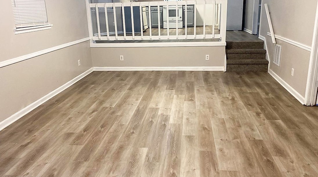 Luxury vinyl plank flooring installed in a living and dining room